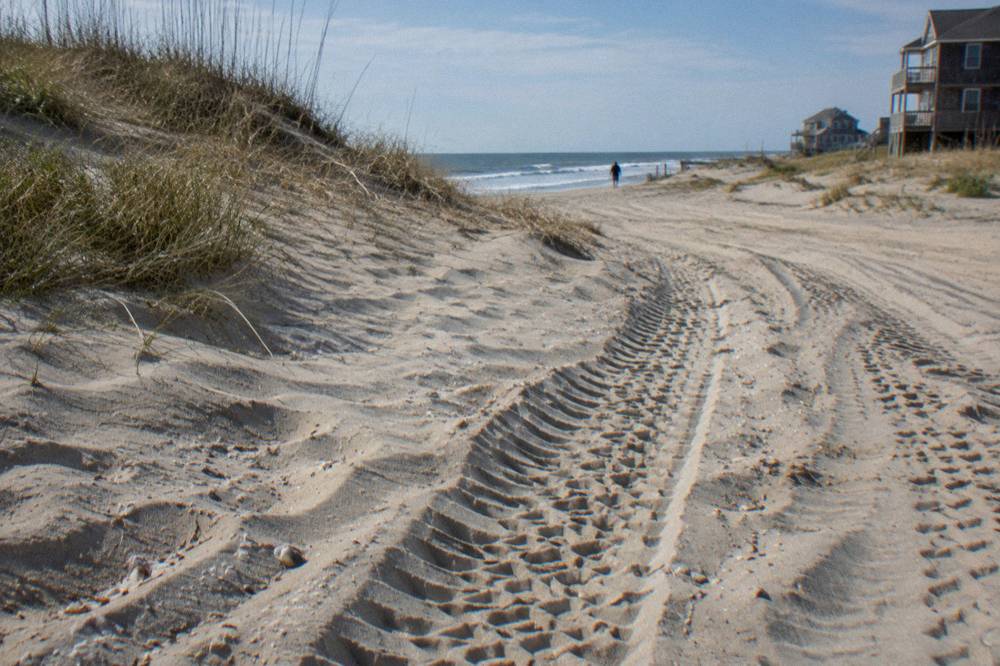 Tracks in soft sand showing the texture of an off-road beach route