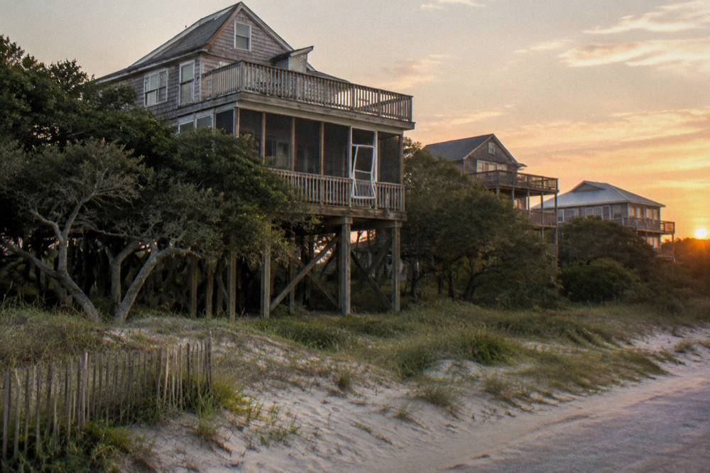 Evening light over rentals and the dune line at the north end of Corolla near the end of the paved road